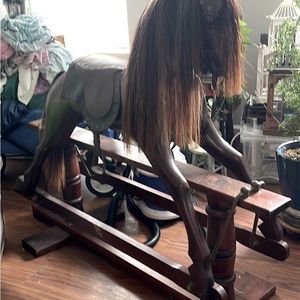 Mahogany, & it has brass fittings rockers & real horse hair for mane n tail